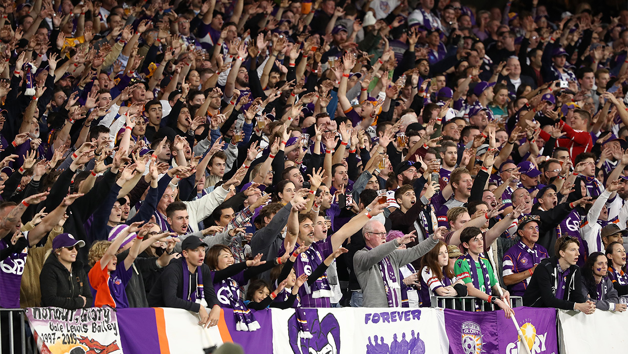 Grand Final - fans with arms raised